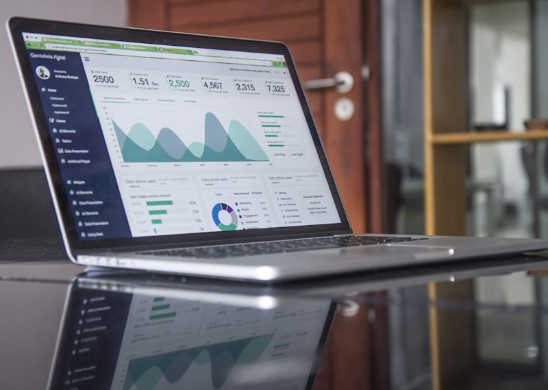 Digital business growth — laptop with analytics and marketing dashboards